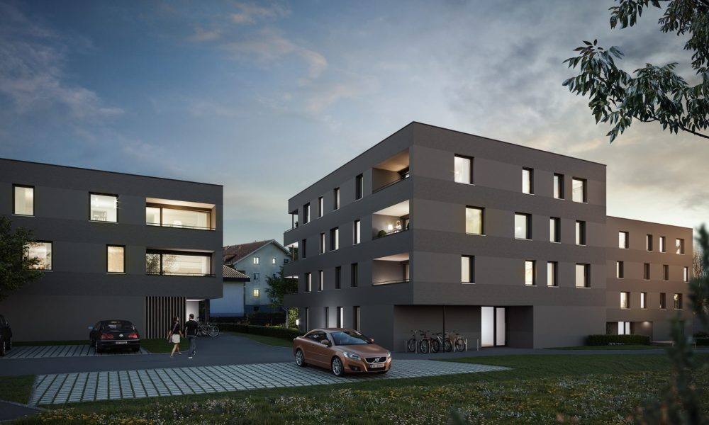 Visualisierung Außenansicht Eigentumswohnungen und Parkplatz Wohnanlage Bachgasse in Dornbirn bei Nacht
